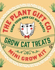 A cat grass and catnip grow kit, including a packet of seeds, soil, and a grow tray, displayed on a neutral background.