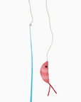 Toy fishing rod cat toy with a red fish on a white background
