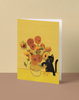 Greeting card with sunflowers and a black cat on a yellow background