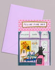 Greeting card with 'Feline Fine Art' design featuring a cat-themed gallery on a gray background.
