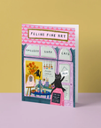 Blank card with a cat-themed design of a gallery shop on a yellow and pink background