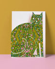 A cat greeting card with a colourful illustration of a cat blending various artistic styles, standing against a mustard background.