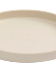 Beige ceramic cat dish with 'Kiln' branding on a white background