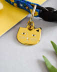 Close up of the Cat version of Vincent VanGough cat collar tag