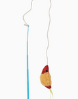 Cat toy with a mouse-shaped end on a string against a white background