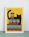 Framed artwork of a black cat surrounded by Tinnies fish soup cans on a yellow background.