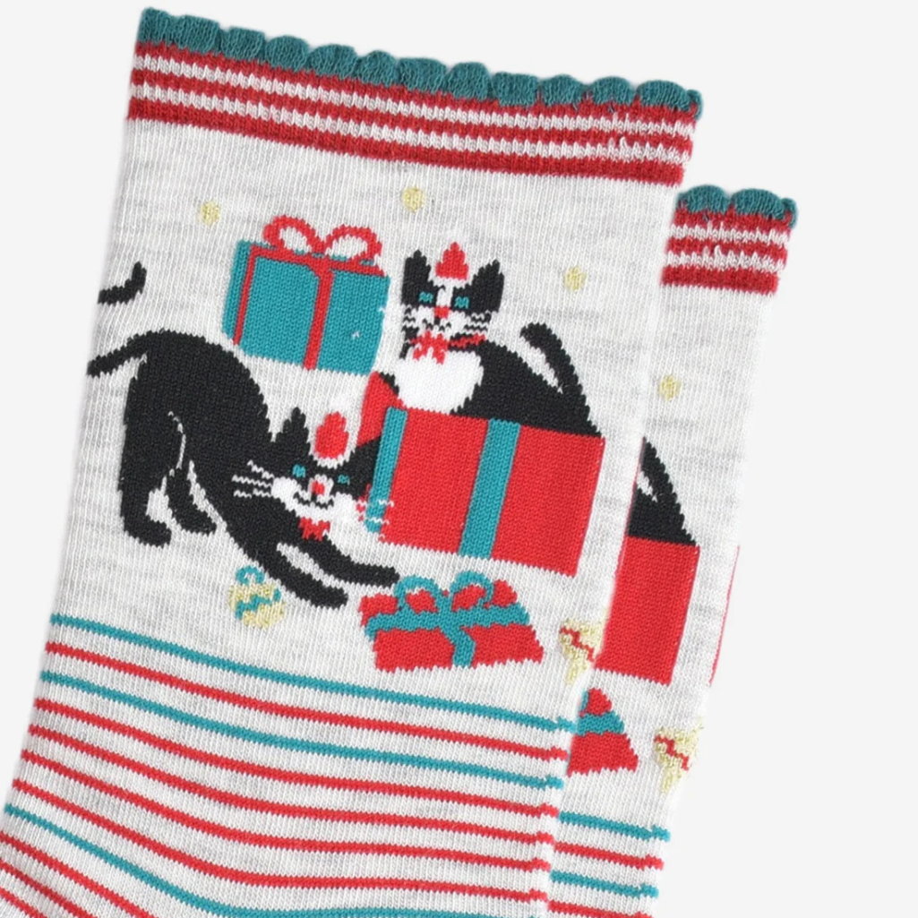 Socks with tuxedo cats and gift boxes design on a white background