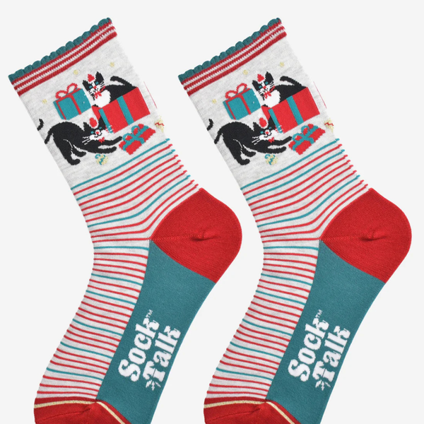 Pair of socks with festive design featuring cats and presents, branded 'Sock Talk'.