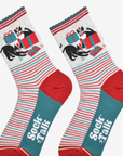 Pair of socks with festive design featuring cats and presents, branded 'Sock Talk'.