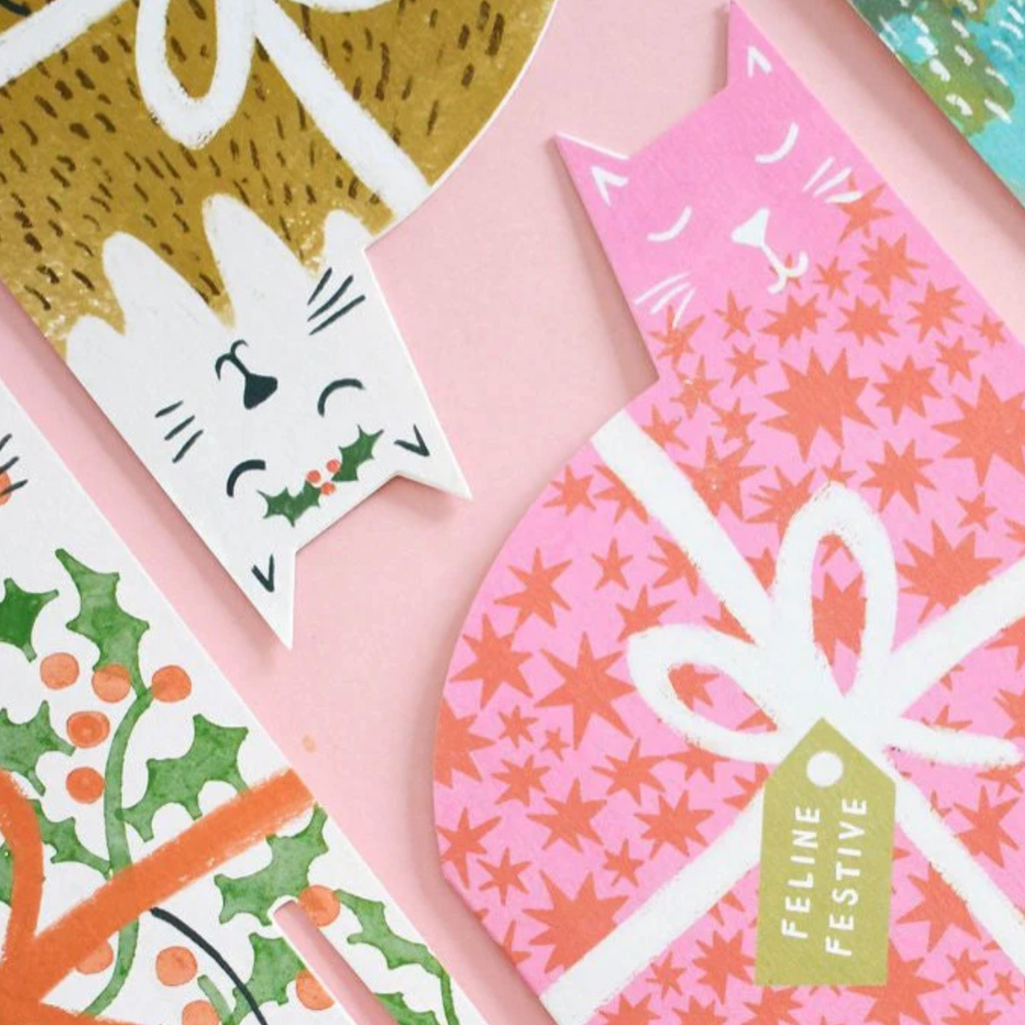 Collection of festive greeting cards with cat designs and &#39;Feline Festive&#39; text.