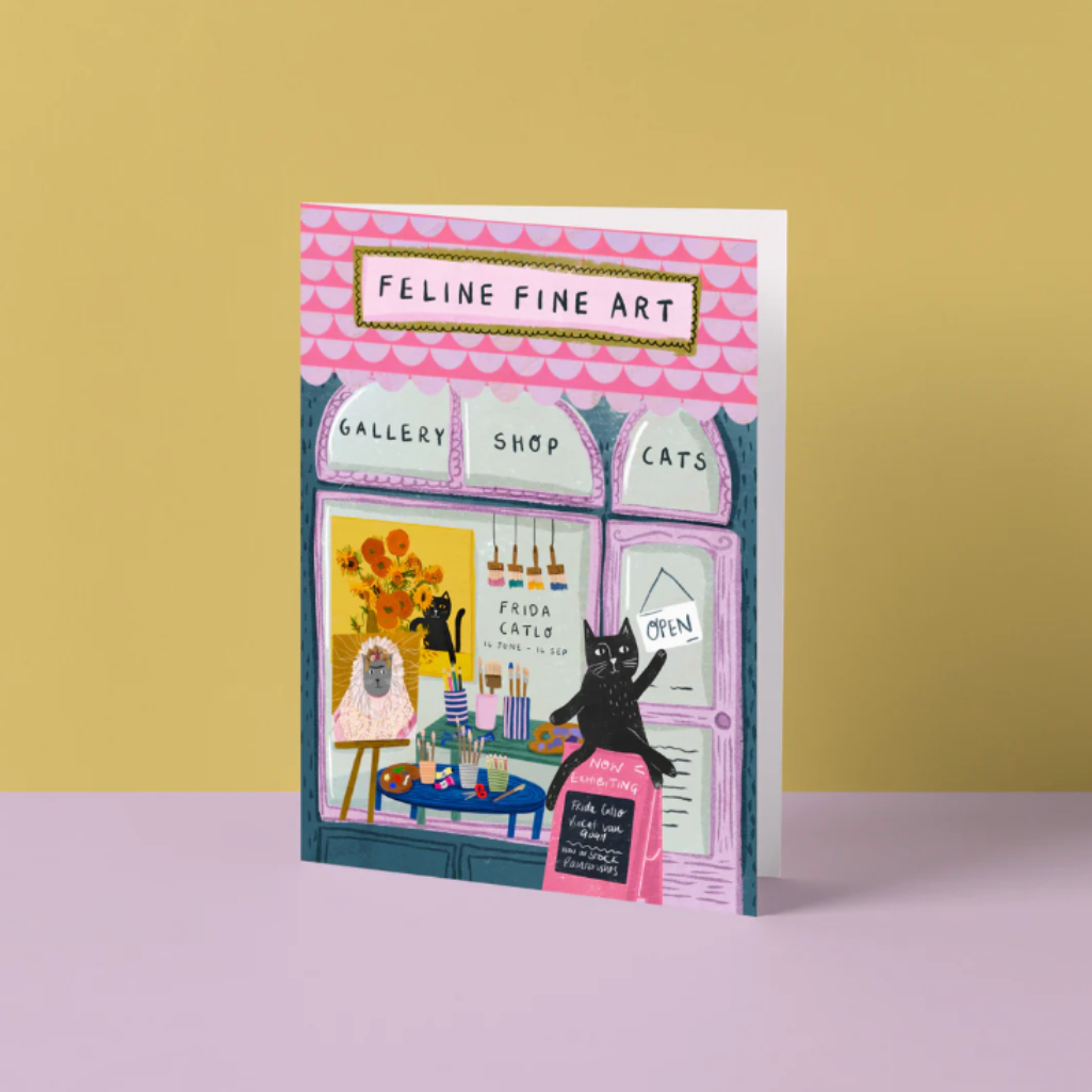Blank card with a cat-themed design of a gallery shop on a yellow and pink background