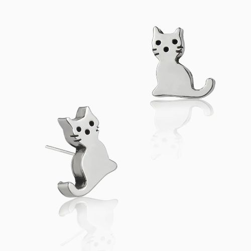 Cat-shaped silver earrings on a white background